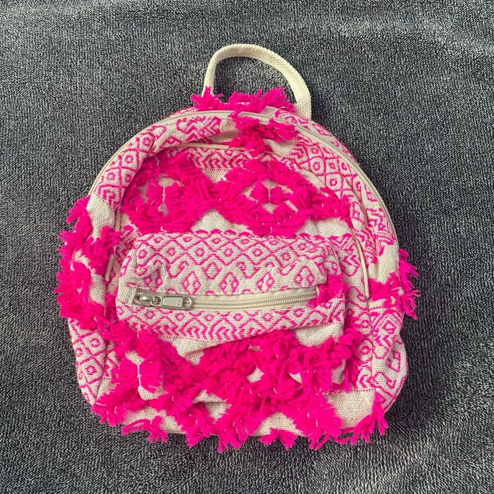 Boho fringe mini backpack‎ in neon pink and coral canvas.